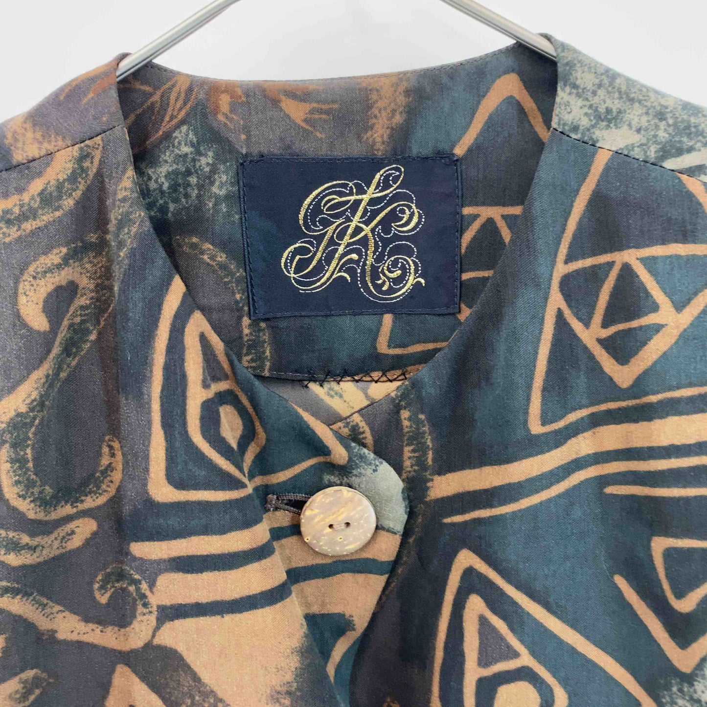 伊太利屋  レディース テーラードジャケット 総柄 ブラウングリーン系