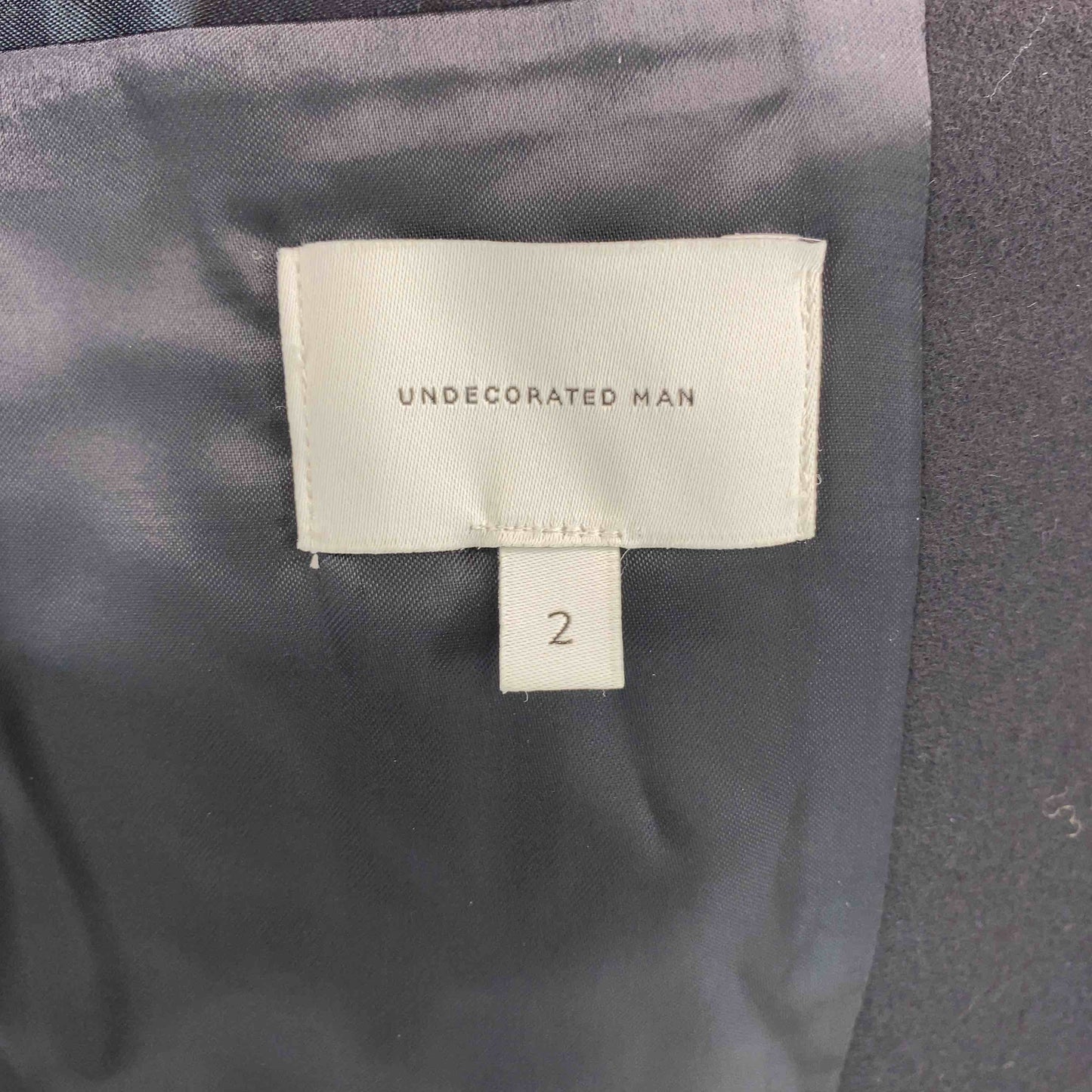 undecorated MAN アンデコレイテッドマン メンズ ノーカラージャケット ウール ブラック パッチポケット センターベント